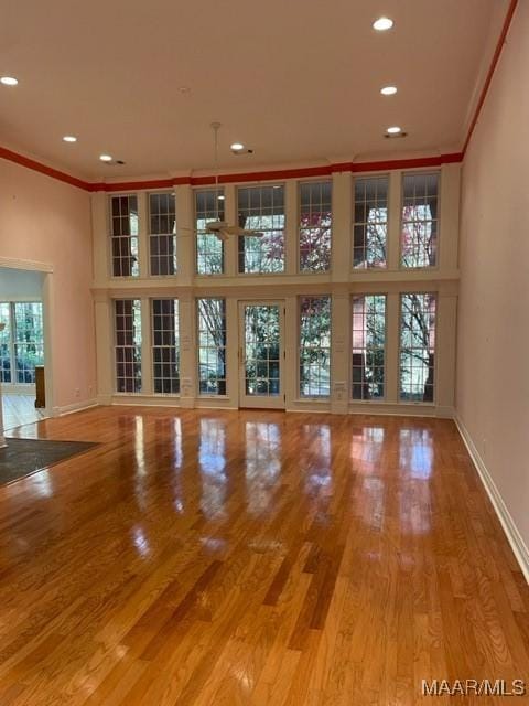 spare room with hardwood / wood-style flooring and ornamental molding