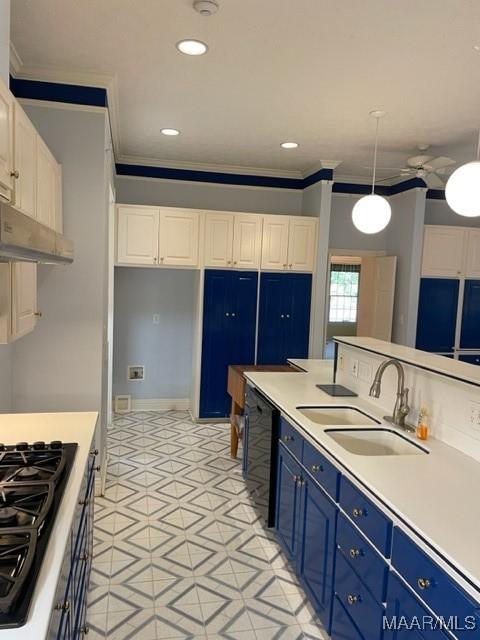 kitchen featuring pendant lighting, black appliances, crown molding, sink, and white cabinetry