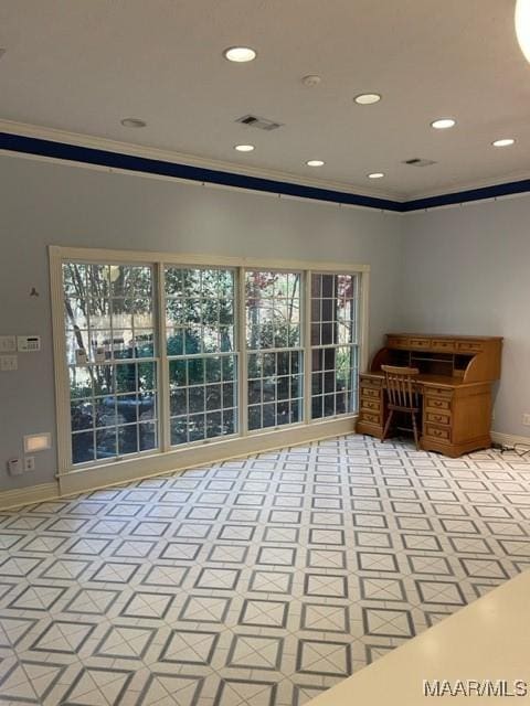 interior space featuring a healthy amount of sunlight and ornamental molding