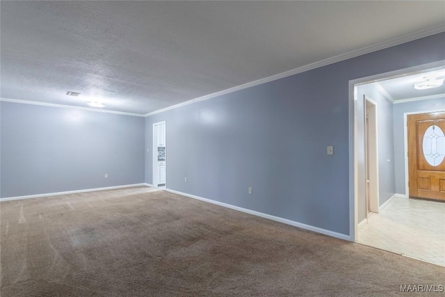 carpeted empty room featuring a textured ceiling and ornamental molding