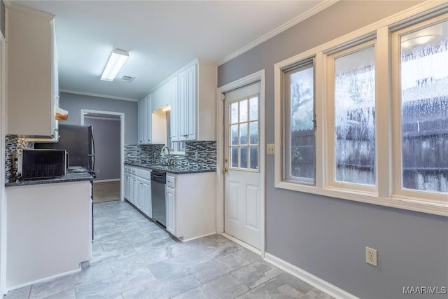 kitchen with backsplash, stainless steel dishwasher, ornamental molding, sink, and white cabinetry