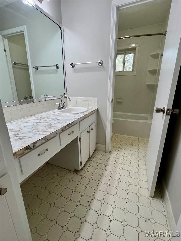 bathroom featuring vanity and shower / bath combination