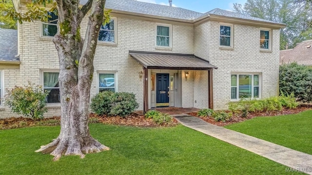 view of front of home with a front yard