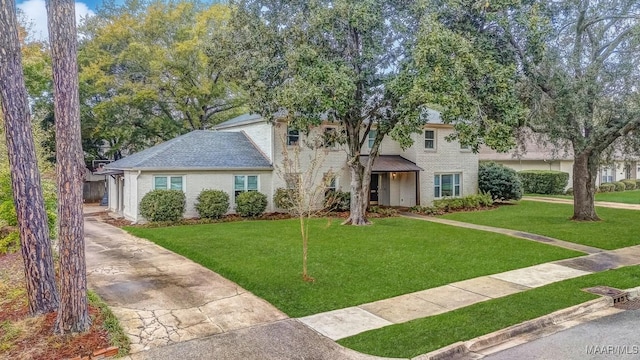 view of front of home with a front lawn