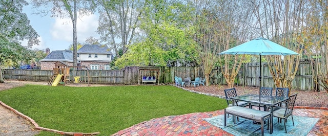 view of yard with a patio and a playground