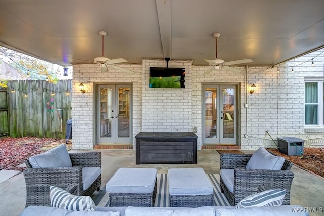 view of patio featuring outdoor lounge area, ceiling fan, and french doors