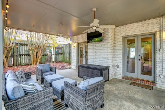 view of patio featuring ceiling fan, french doors, and an outdoor living space