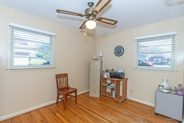 sitting room featuring ceiling fan, a healthy amount of sunlight, and light hardwood / wood-style floors