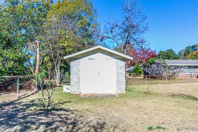 view of outbuilding with a lawn