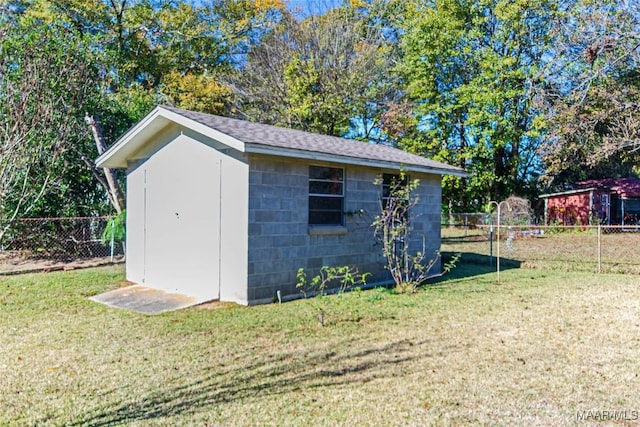 view of outbuilding featuring a yard