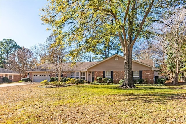 single story home featuring a garage and a front lawn