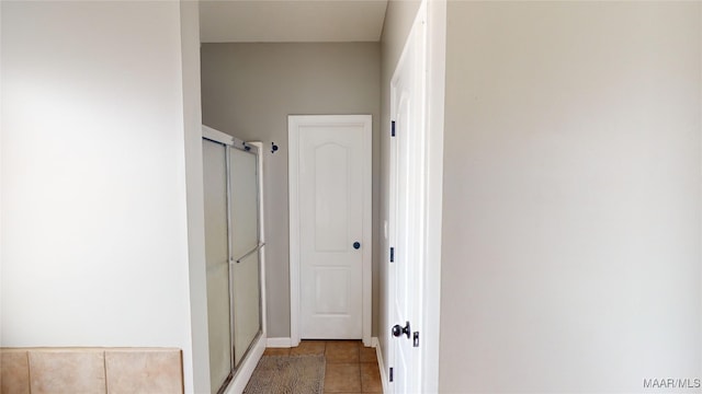 hall featuring tile patterned flooring