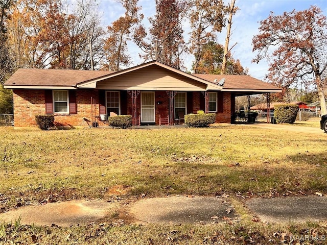 single story home featuring a front lawn and a carport