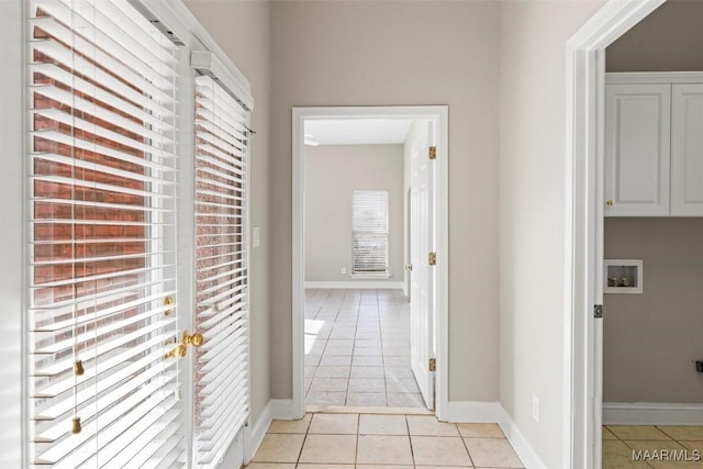 hallway with light tile patterned flooring