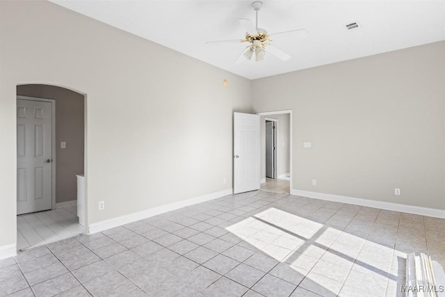 spare room featuring light tile patterned floors and ceiling fan