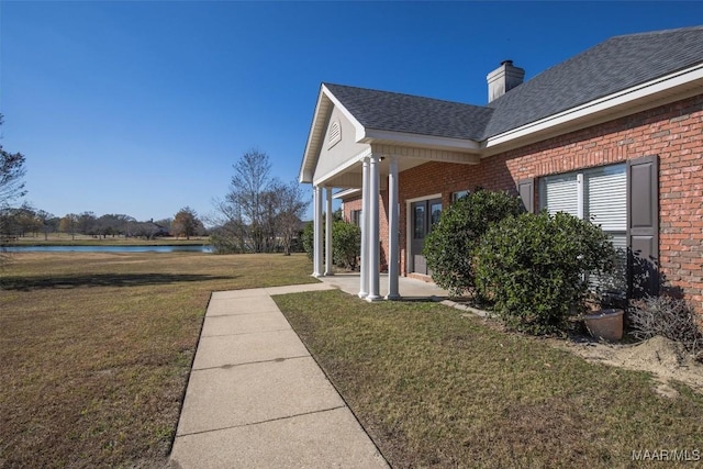 view of side of property featuring a yard