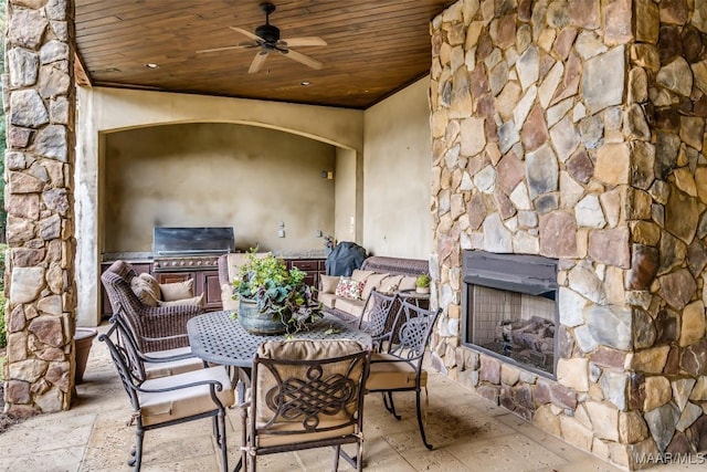 view of patio / terrace with area for grilling, ceiling fan, and grilling area