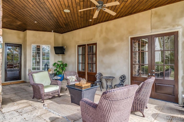 view of patio featuring ceiling fan and french doors