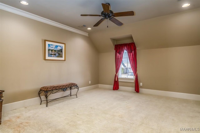 living area with lofted ceiling, carpet floors, ceiling fan, and crown molding