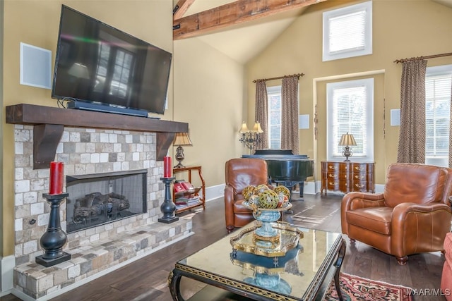 living room featuring a fireplace, beamed ceiling, high vaulted ceiling, and dark wood-type flooring