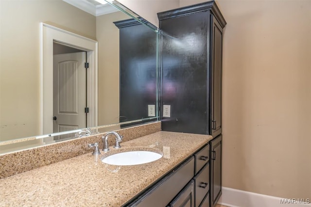 bathroom with vanity and crown molding