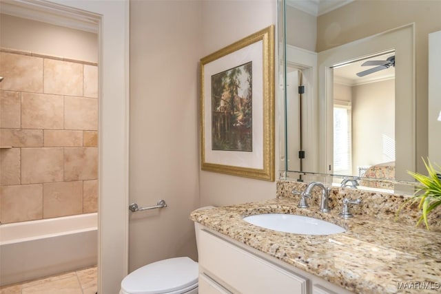 full bathroom with ceiling fan, toilet, crown molding, and vanity