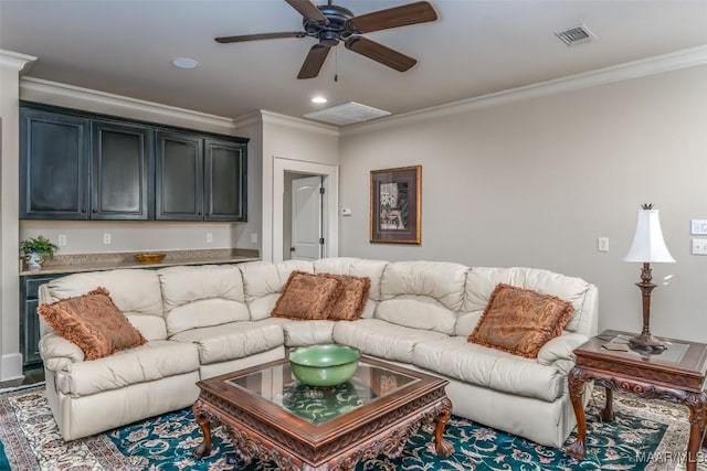 living room with dark hardwood / wood-style flooring, ceiling fan, and crown molding