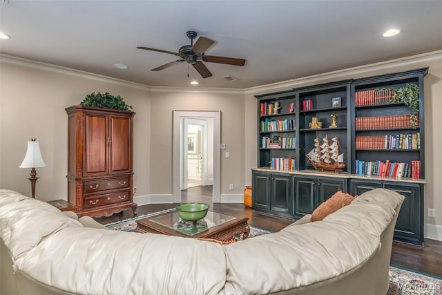 living room featuring ceiling fan, dark hardwood / wood-style floors, and ornamental molding