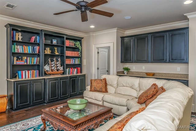 living room with crown molding, ceiling fan, and dark hardwood / wood-style floors