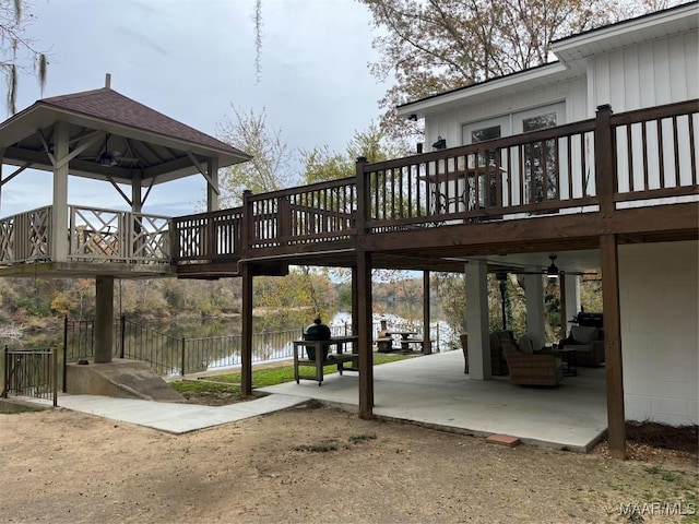 exterior space featuring a deck with water view