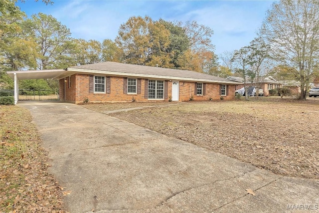 ranch-style house featuring a carport