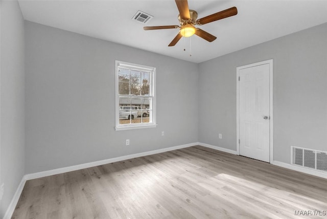 unfurnished room with light wood-type flooring and ceiling fan