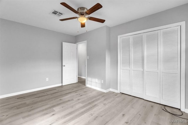 unfurnished bedroom featuring a closet, ceiling fan, and light hardwood / wood-style flooring