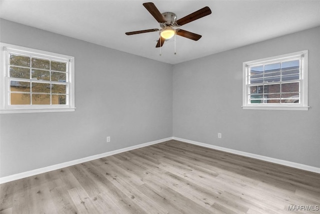 spare room with ceiling fan and light hardwood / wood-style flooring