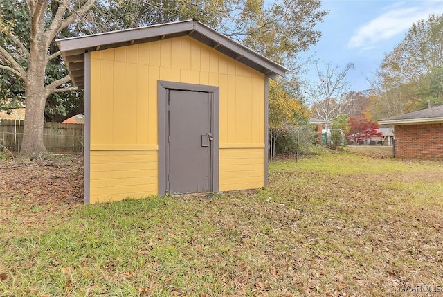 view of outbuilding featuring a yard