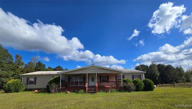 view of front facade featuring covered porch and a front yard