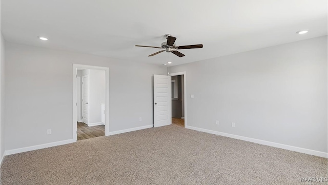 unfurnished bedroom featuring ceiling fan and carpet