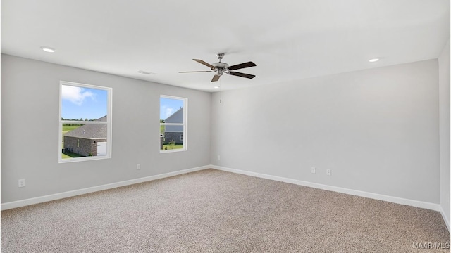 carpeted empty room with ceiling fan