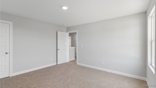 unfurnished bedroom with carpet flooring