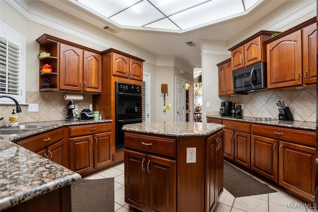 kitchen featuring a center island, sink, black double oven, tasteful backsplash, and light tile patterned flooring