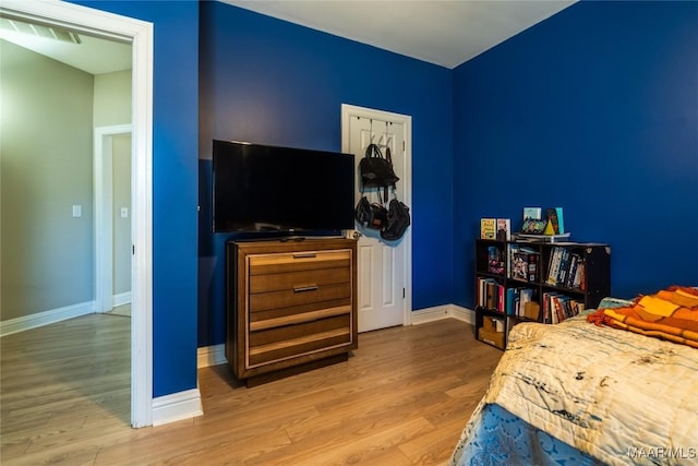 bedroom with hardwood / wood-style flooring