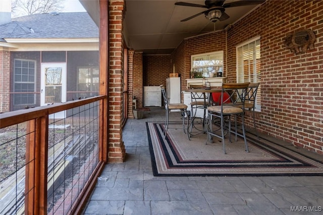 view of patio featuring ceiling fan