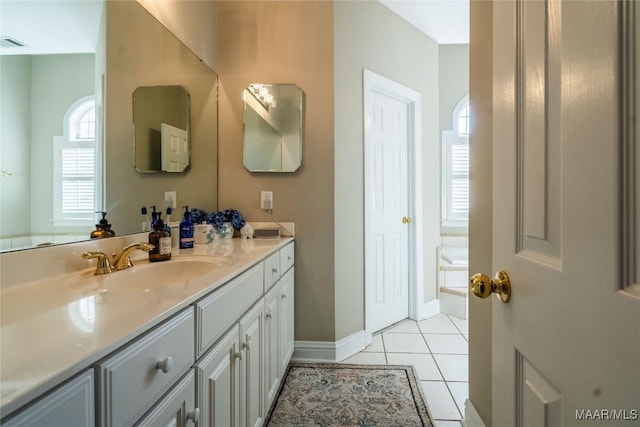 bathroom featuring tile patterned flooring and vanity