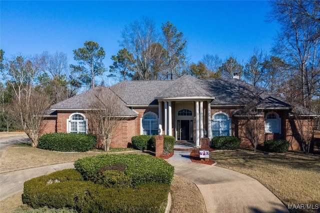 ranch-style house with a front yard