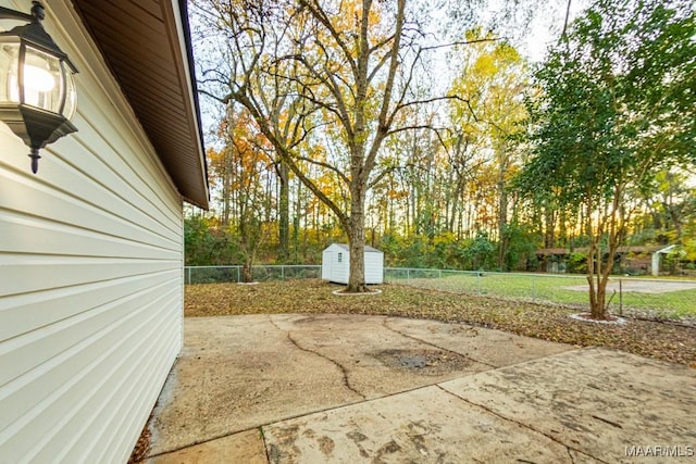 view of patio / terrace featuring a storage unit