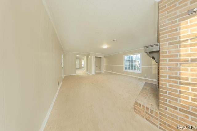 unfurnished living room with carpet flooring and ornamental molding