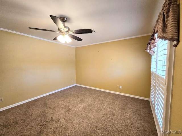 carpeted spare room with ceiling fan and ornamental molding