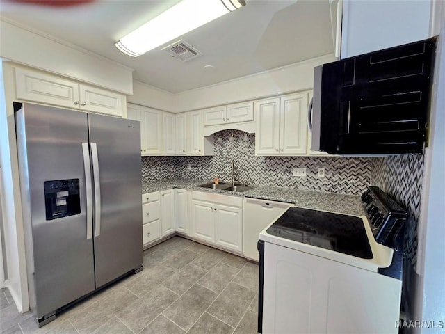 kitchen featuring electric range oven, tasteful backsplash, sink, stainless steel fridge with ice dispenser, and white cabinetry