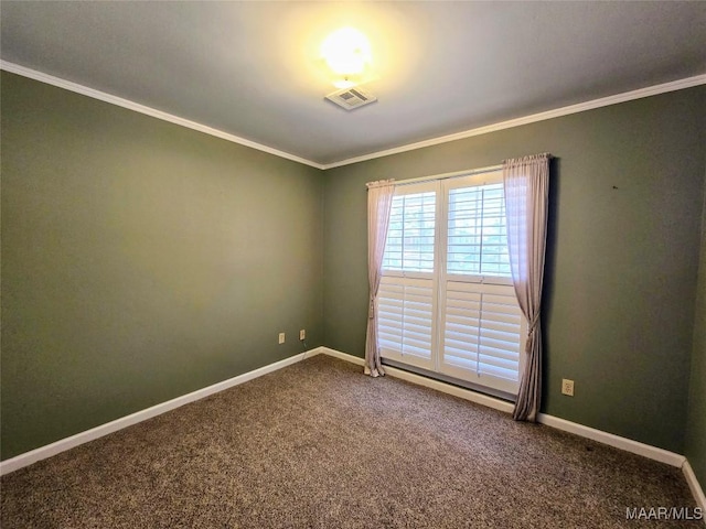 carpeted empty room featuring crown molding