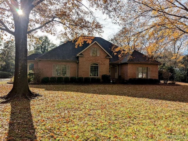 front facade with a front yard